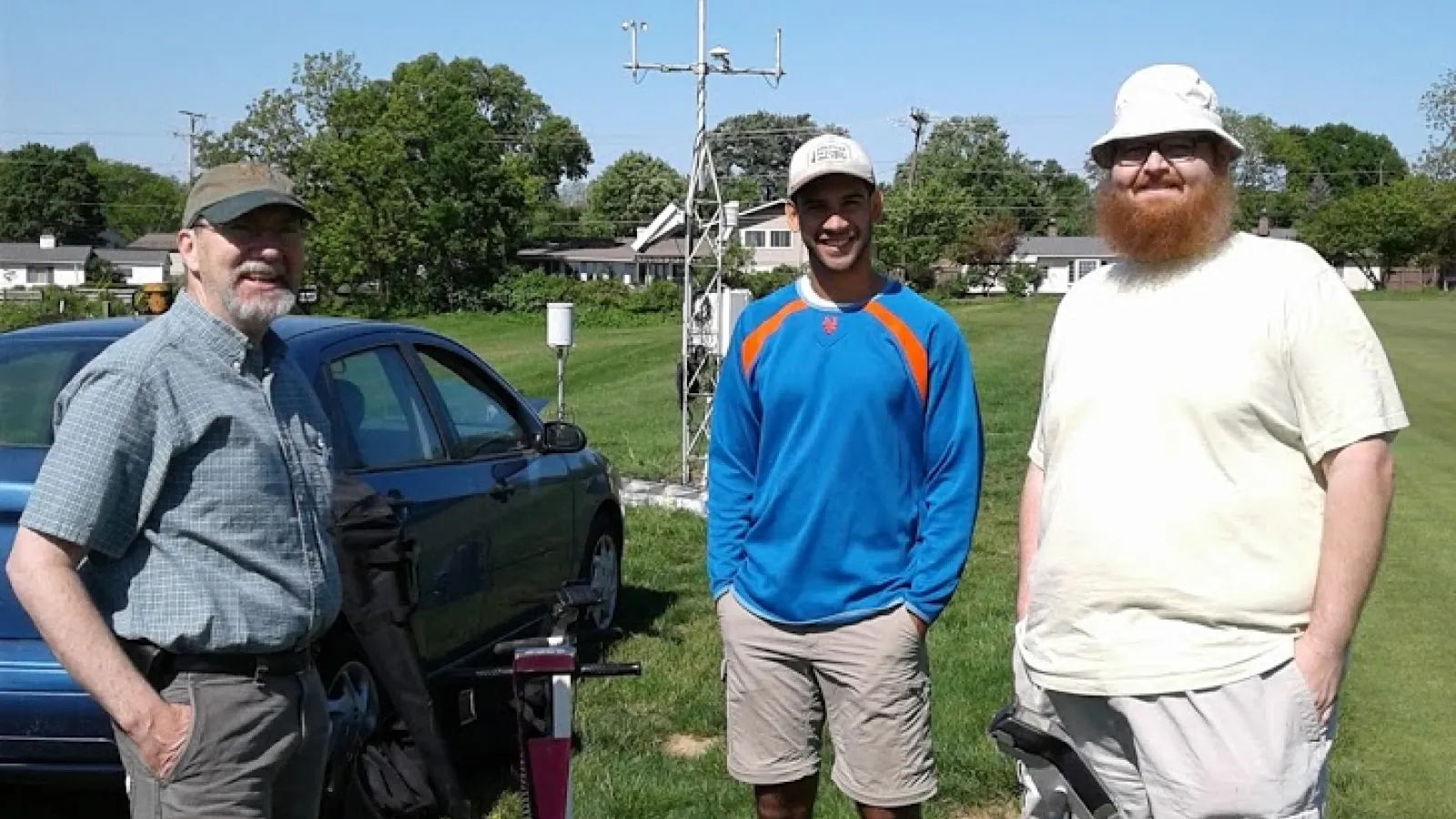 Assistant State Climatologist Jim DeGrand, Undergraduate Research Stephen Maldonado, and SCOO collaborator Aaron Wilson pose for a picture near the OARDC-Columbus meteorological tower preparing to intall soil moisture probes in the ground.