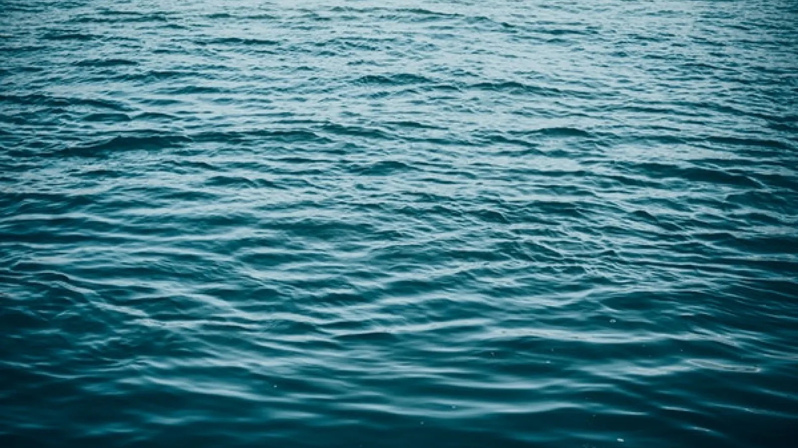 surface picture of blue calm body of water 