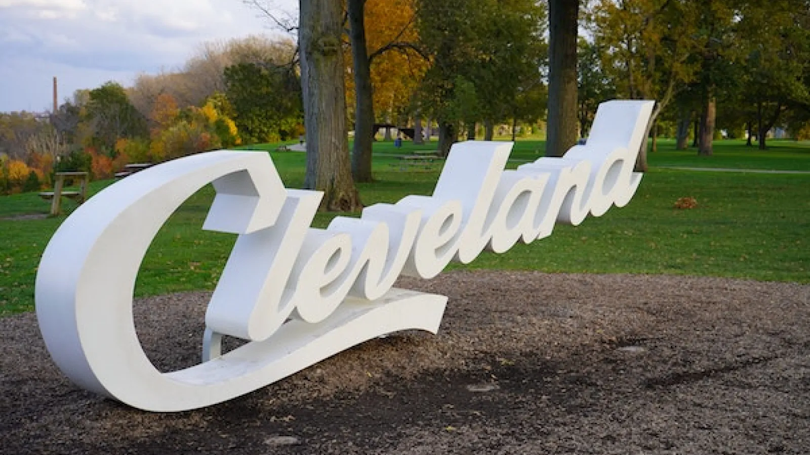 White Cleveland Script Sign in a Park