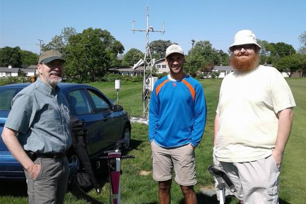 Assistant State Climatologist Jim DeGrand, Undergraduate Research Stephen Maldonado, and SCOO collaborator Aaron Wilson pose for a picture near the OARDC-Columbus meteorological tower preparing to intall soil moisture probes in the ground.