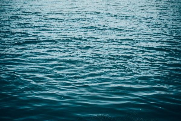 surface picture of blue calm body of water 