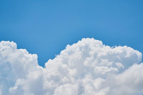 Puffy cloud and blue skies