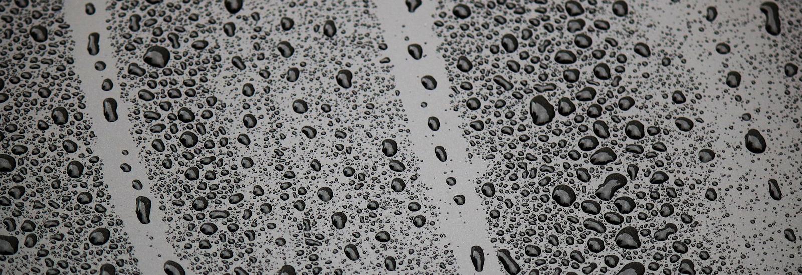 Stock image of rain on car